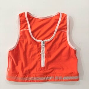 Adam Selman Sport orange zip top white trim Brand logo on back Size Large